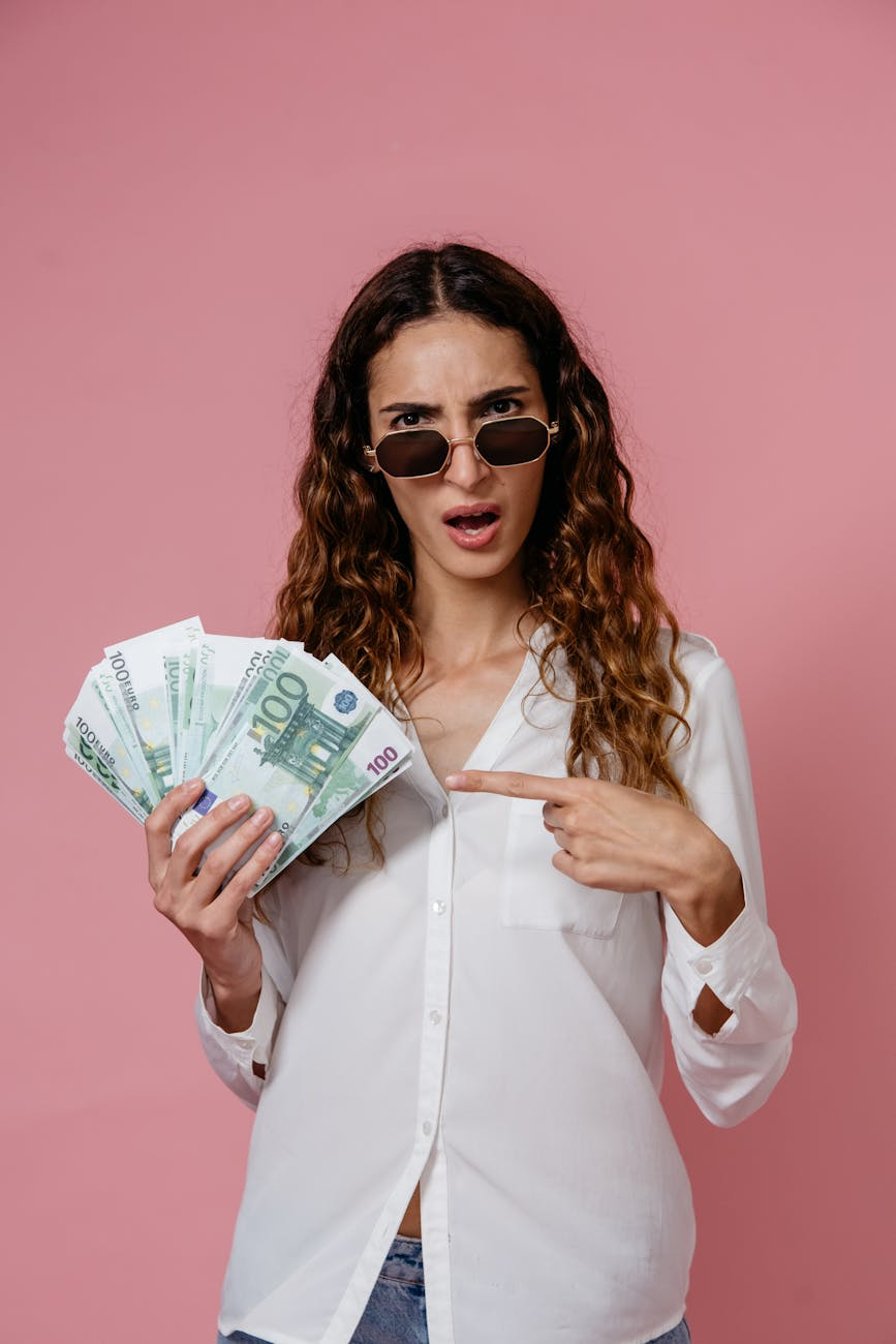 a woman in white long sleeves holding money